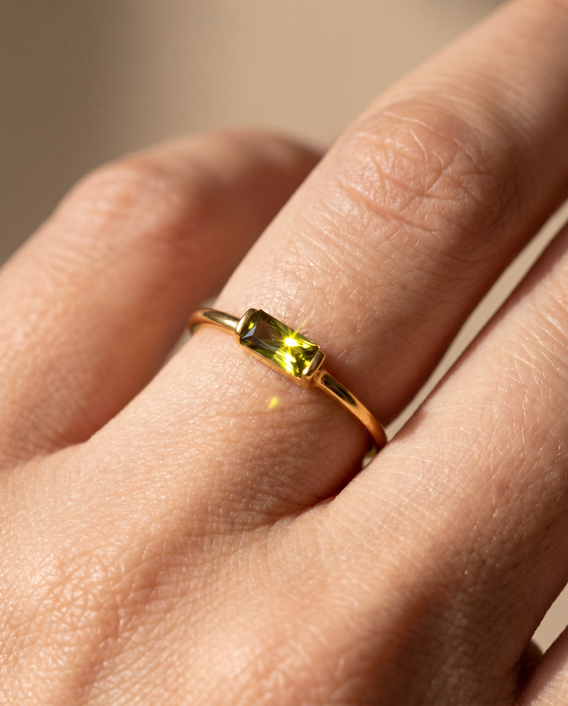 Noor Birthstone Minimal Ring in gold on a hand