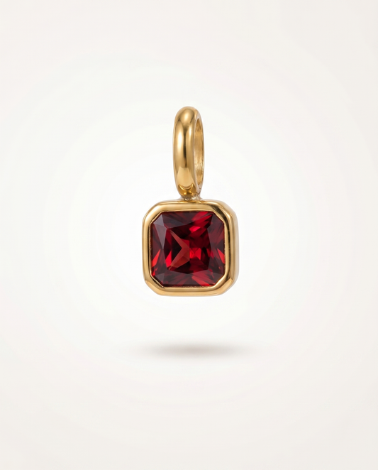Aurea Birthstone Charm in gold with vivid red stone