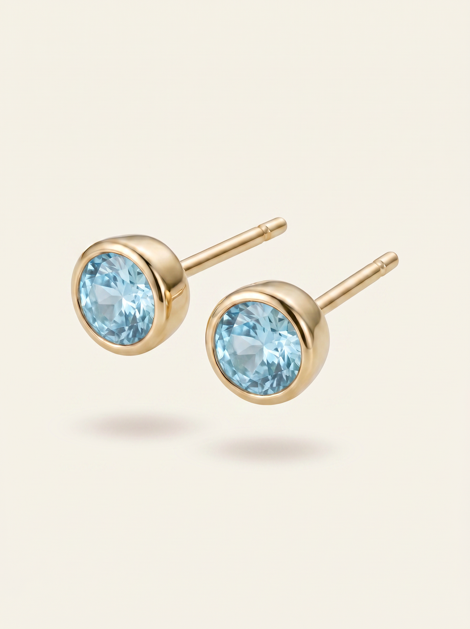 Aris birthstone stud earrings gold light blue