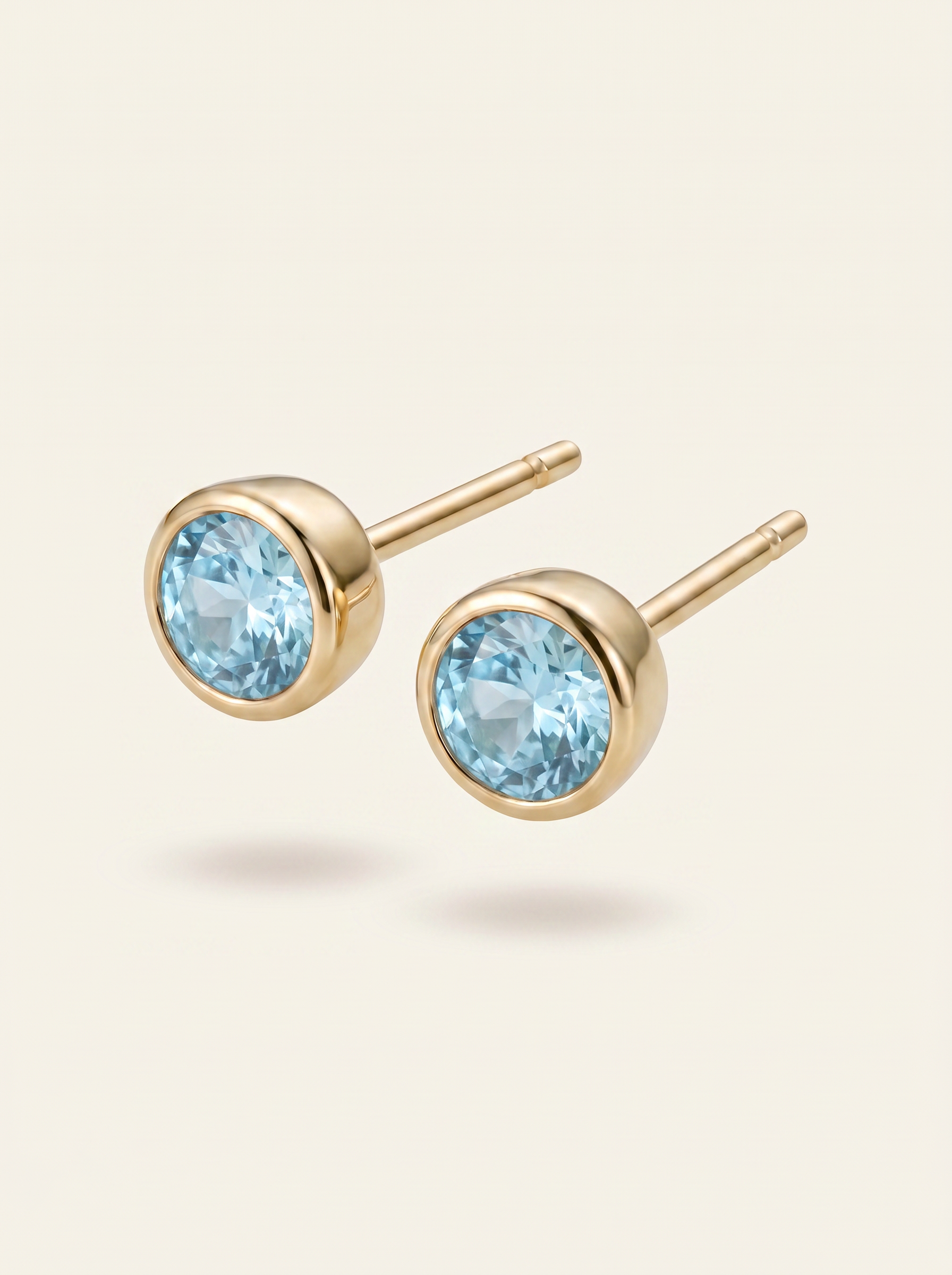 Aris birthstone stud earrings gold light blue